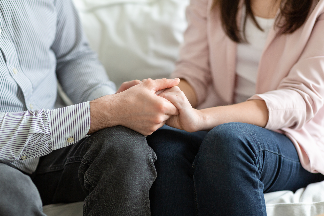 husband and wife holding each others hands during Family Therapy in Philadelphia