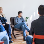 patients sitting in group discussing add vs adhd