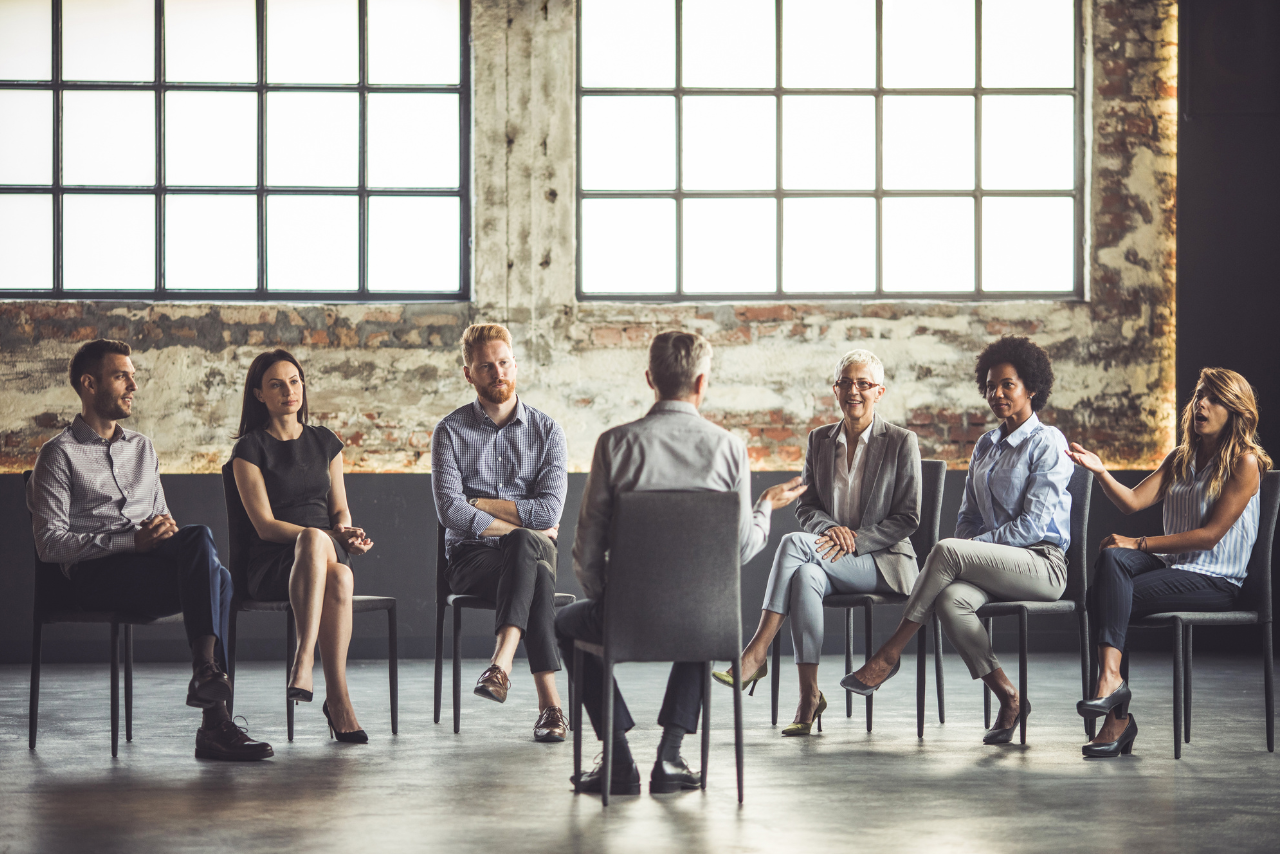 patients sitting in group therapy discussing what is outpatient mental health treatment