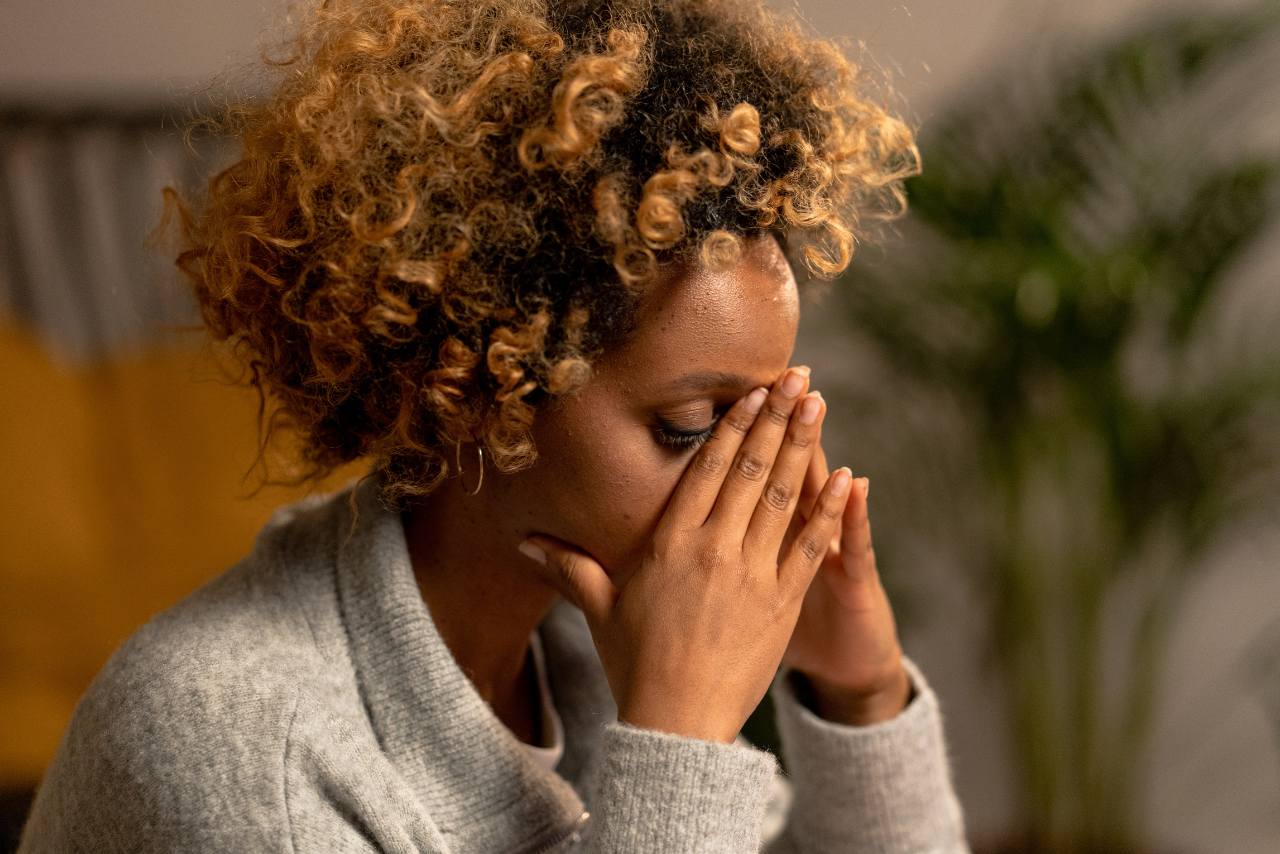 woman struggling with anxiety wondering nurse taking a patients blood pressure while he is asking Can Anxiety Cause High Blood Pressure?