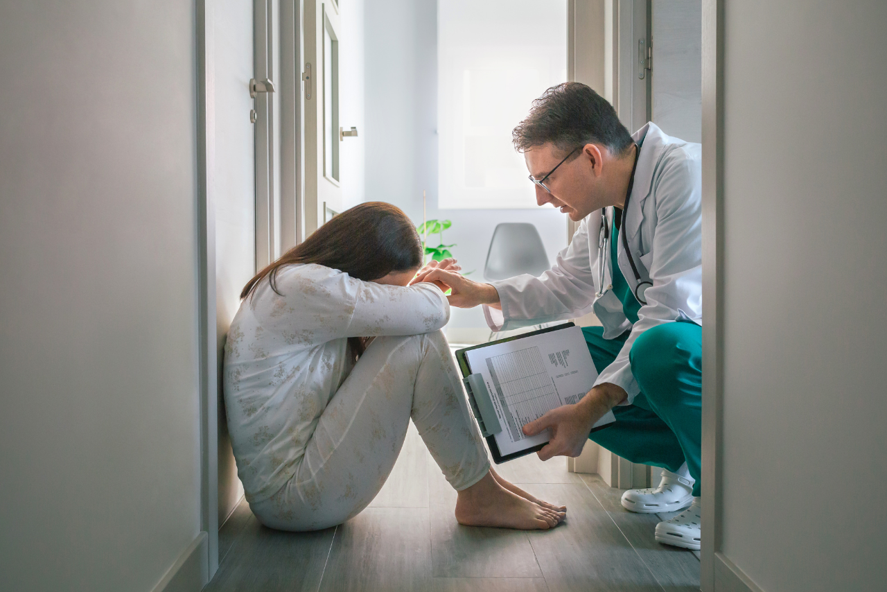 doctor explaining how nurse taking a patients blood pressure while he is asking Can Anxiety Cause High Blood Pressure?