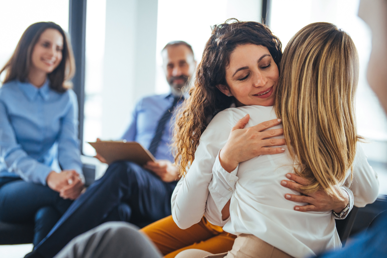 therapist embracing her patient after speaking on the differences of a mood disorder vs personality disorder